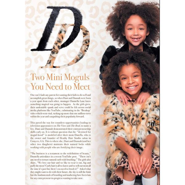 Two young girls dressed in stylish, fur-trimmed outfits smile brightly for a magazine feature titled "Two Mini Moguls You Need to Meet."